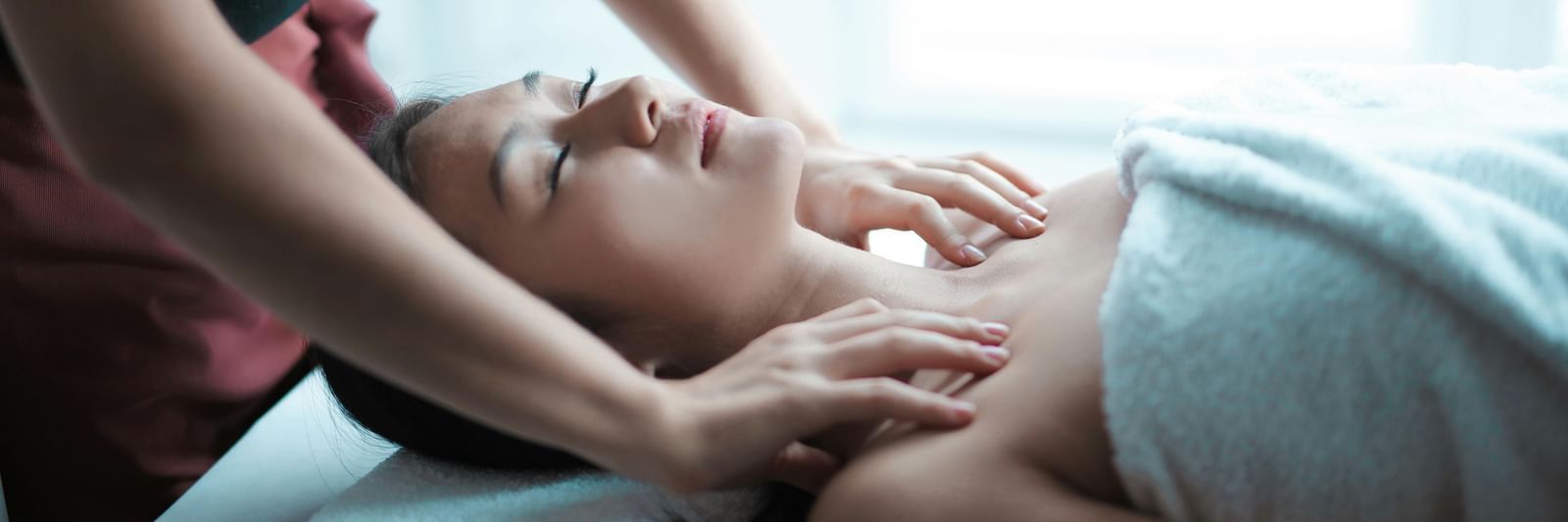 A woman getting a massage at the spa
