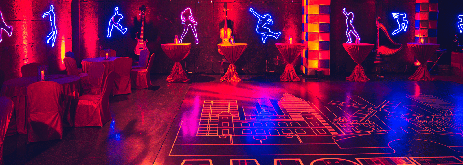 Vibrant dance or fitness studio with neon lights and suspended equipment at Narayani Heights Hotel & Resorts, Ahmedabad.