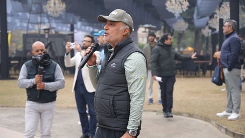 An image of an elderly person giving a speech on golf course for the game day - Heritage Village Resorts & Spa