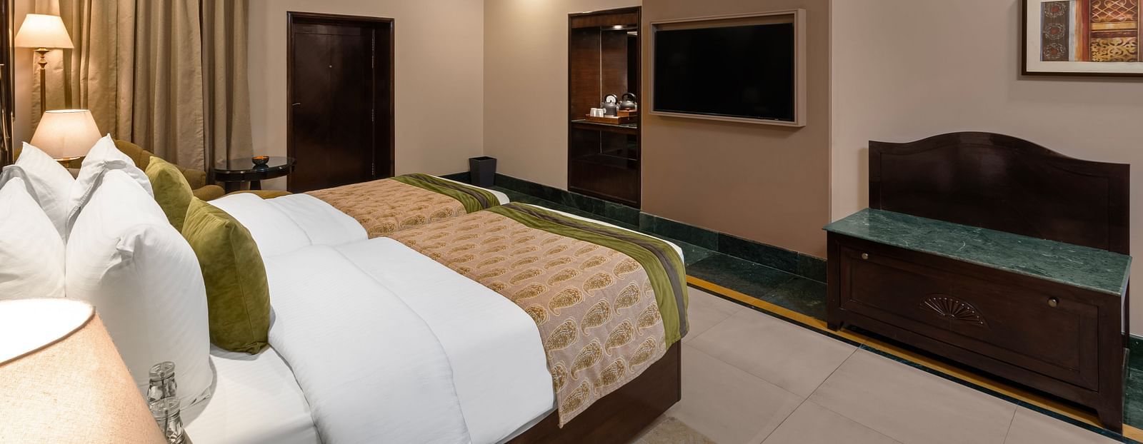 Ganga View Room with a work desk opposite to the bed and standing lamps - Ganga Lahari, Haridwar