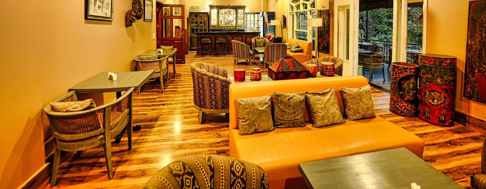 A image of Restaurant interior at Atman, dharamshala, with comfortable seating and warm lighting.