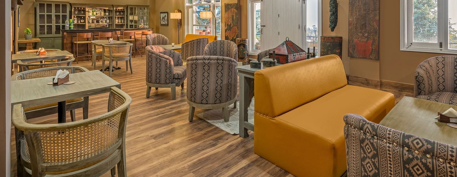 An image of cozy restaurant at Atman, dharamshala with warm lighting and seating options.