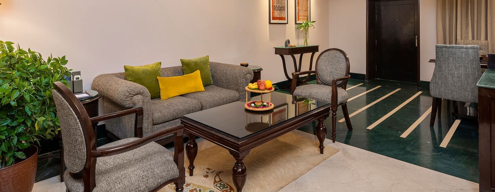 A modern home decorated for Diwali, with lights and flowers adorning the walls and windows.