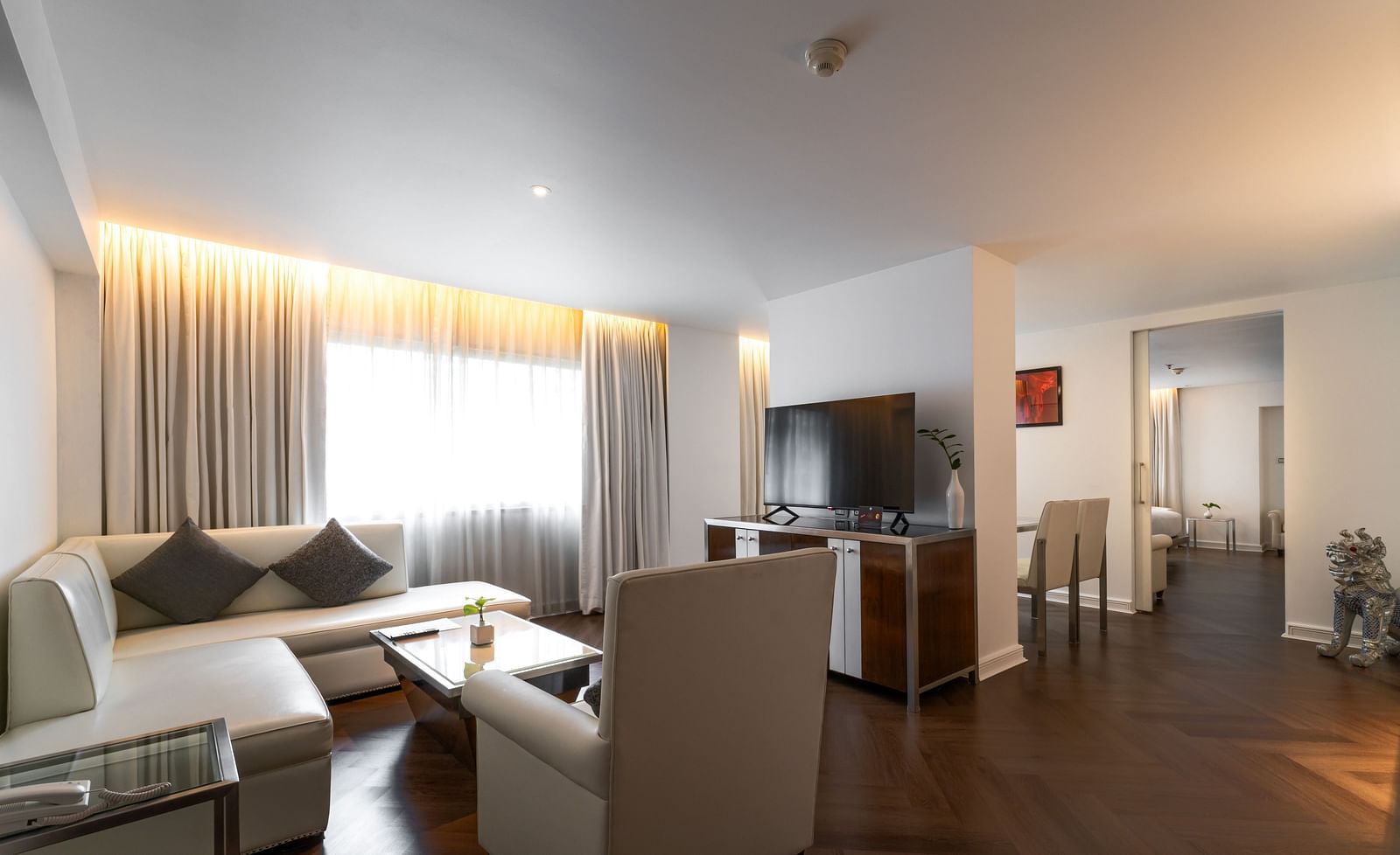 An overview of the living room with sofas and table in view - Night Hotel Bangkok.