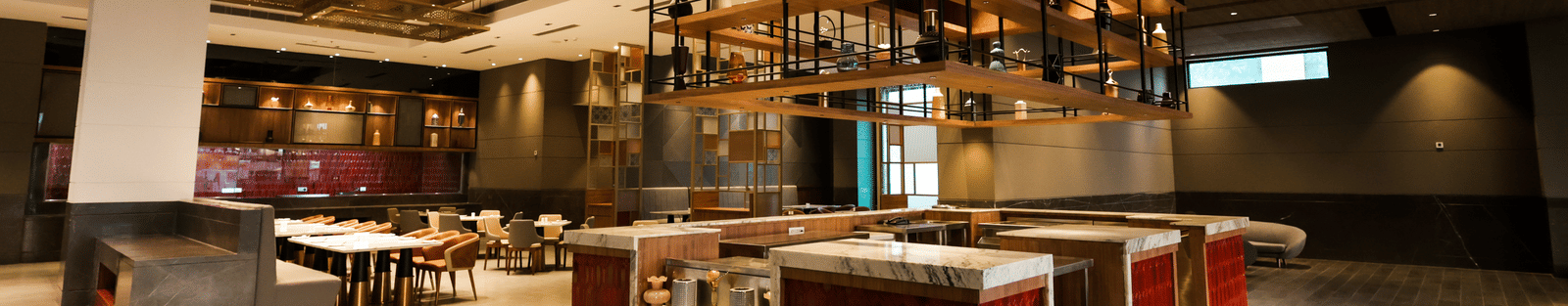 Buffet counter and open kitchen setup inside the restaurant at Ramada by Wyndham Sonipat Murthal