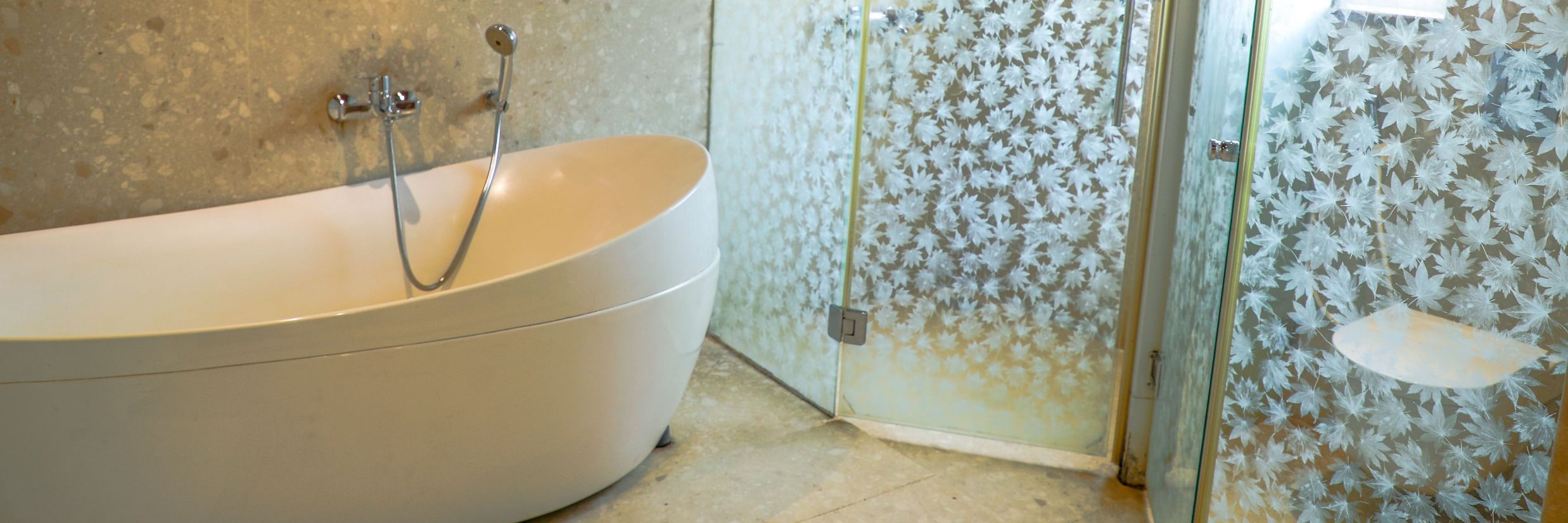a bathtub inside Queen Suite - White pearl suites by rosetum 