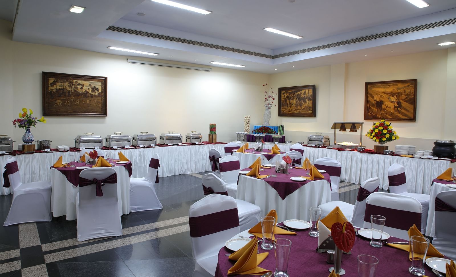 Lagan Hall decked with tables and chairs at Tara, Comfort Hotel in Hyderabad - Ramoji Film City.