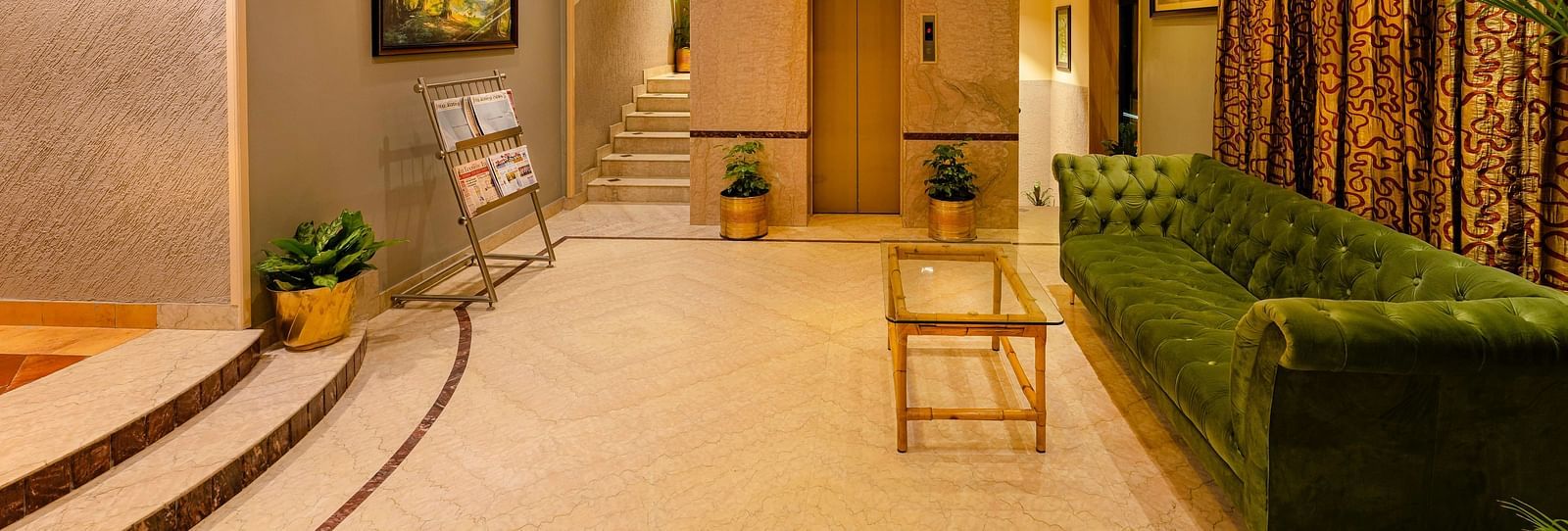 A welcoming reception area with soft lighting and elegant decor - Cross Roads Inn, Bengaluru