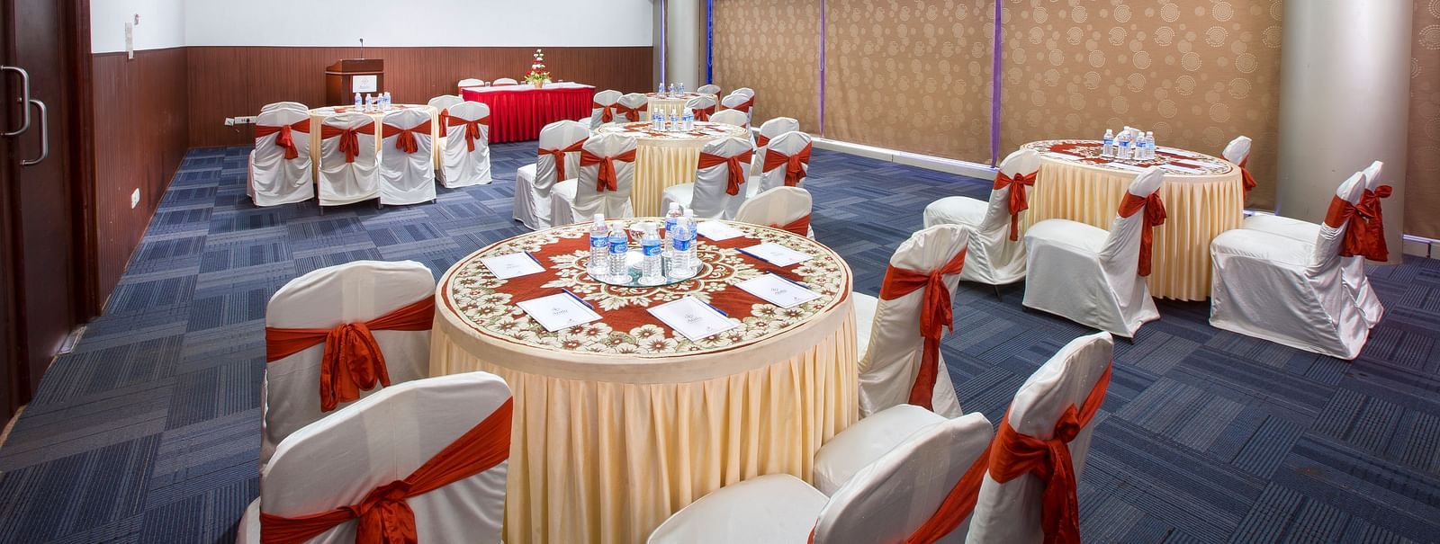 Centre Point at Hotel Atithi - TGI Grand, Pondicherry featuring round tables at chairs