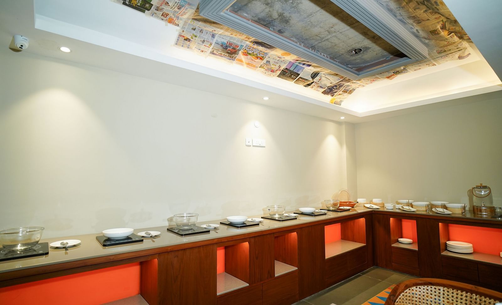 A buffet counter with food warmers and serving dishes in a well-lit room | Sukama Resort & Spa, Nainital