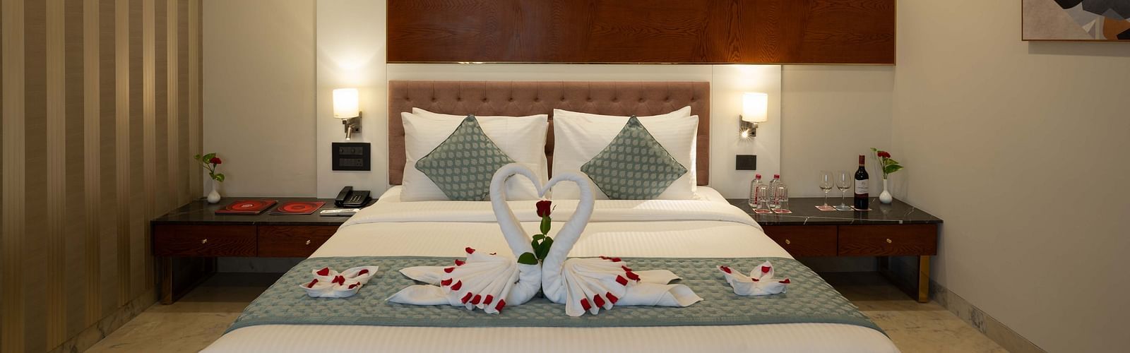 Club Room with a large double bed with decorative amenities artistically arranged at Inde Signature Jaipur