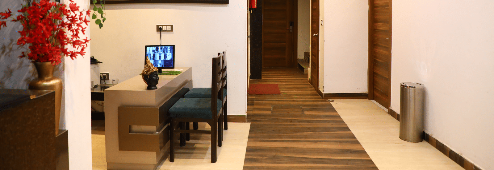 Hotel hallway or common area with a desk, lighting, and modern decor - Perfectstayz Premium at Har Ki Pauri Road (Ganga Heights)