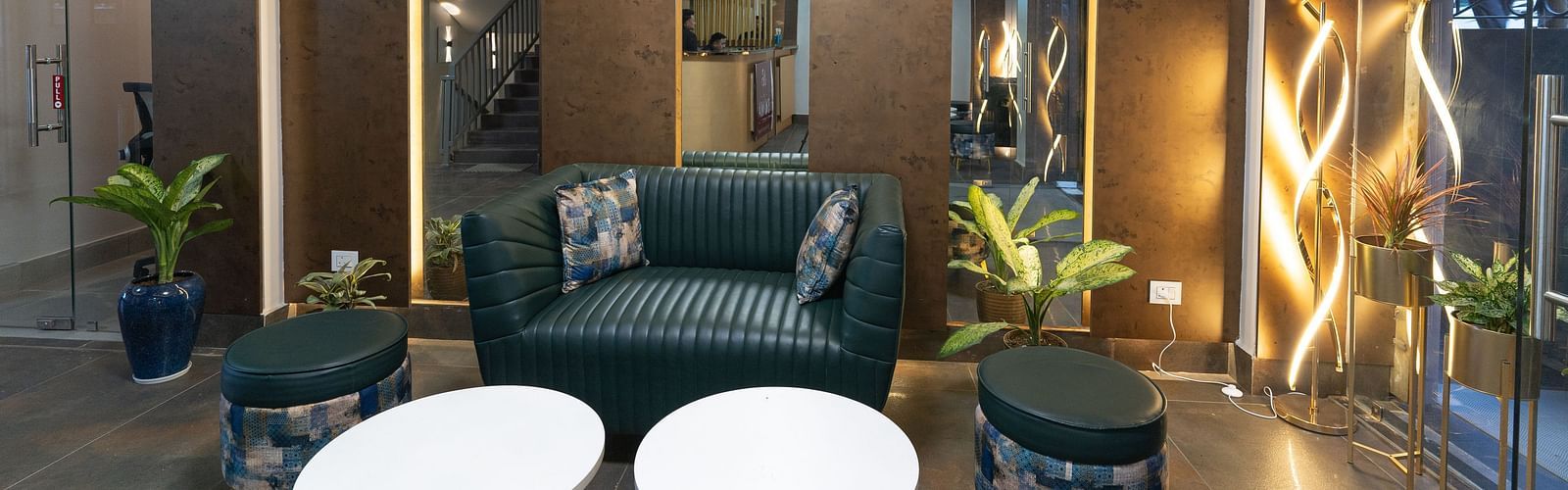 Lobby area with sofas and table at Soma Hotel by Avianna Group
