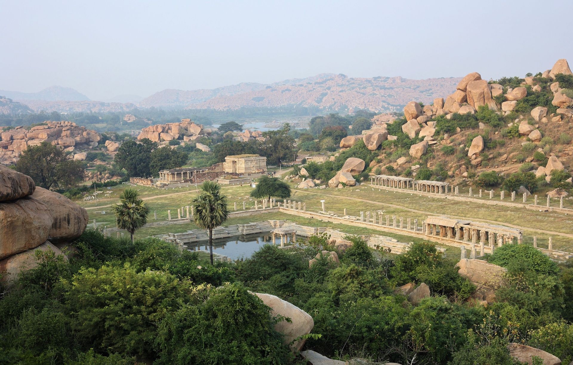 Hampi ancient ruins with temples and rocky hills.