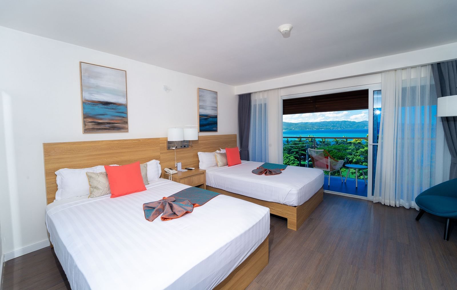 An image of a hotel room in Montego Bay with a balcony that offers the view of the shore - Hotel 39, Jamaica (Montego Bay)