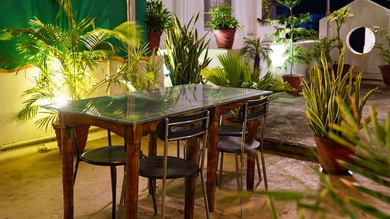 a table at the rooftop dining area of La Paradise Residency