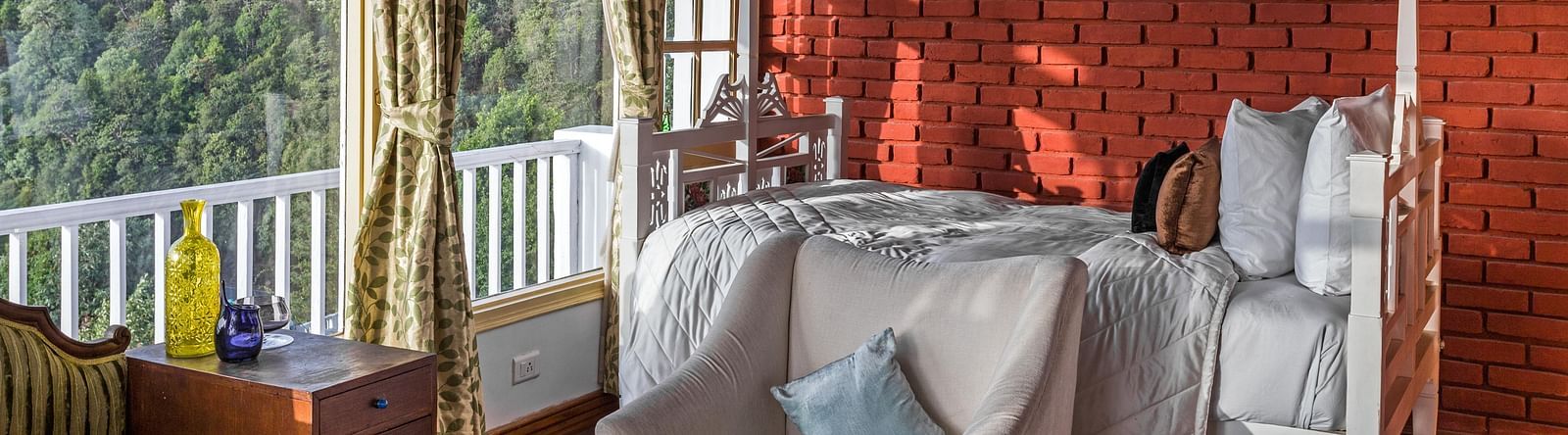 Interior image of a room with comfy seating and beautiful view at Te Aroha By Shervani, Mukteshwar
