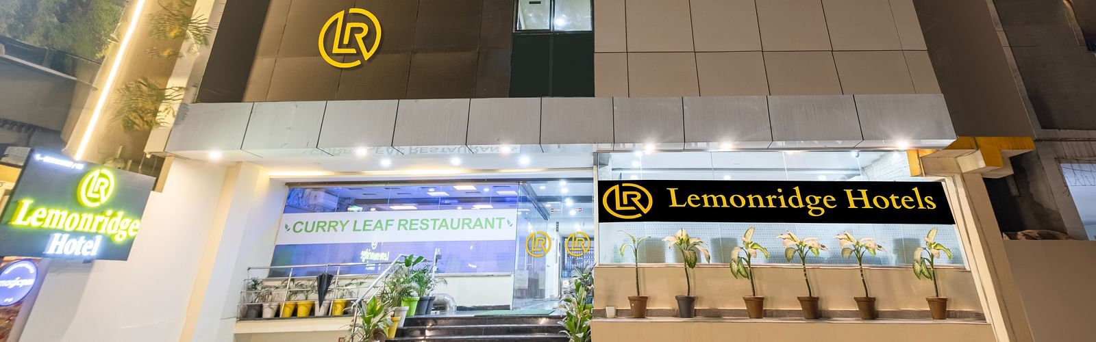 Nighttime view of the hotel's facade at Lemonridge Hotels.