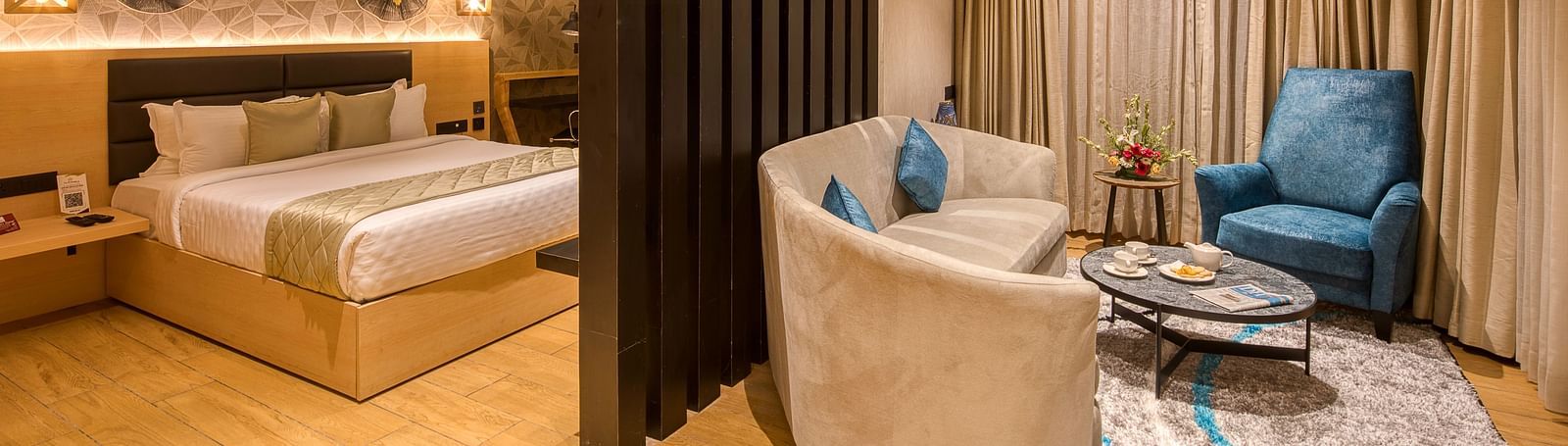 Double bed and the living area in the Sumo Suite at Le Foliage by TGI, Bangalore