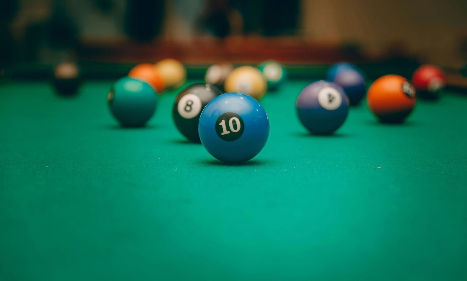 A close up of balls placed on a billiards table
