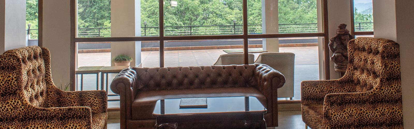 Lobby area with sofas and large glass wall at  Avianna Ganagtok Resort and Spa