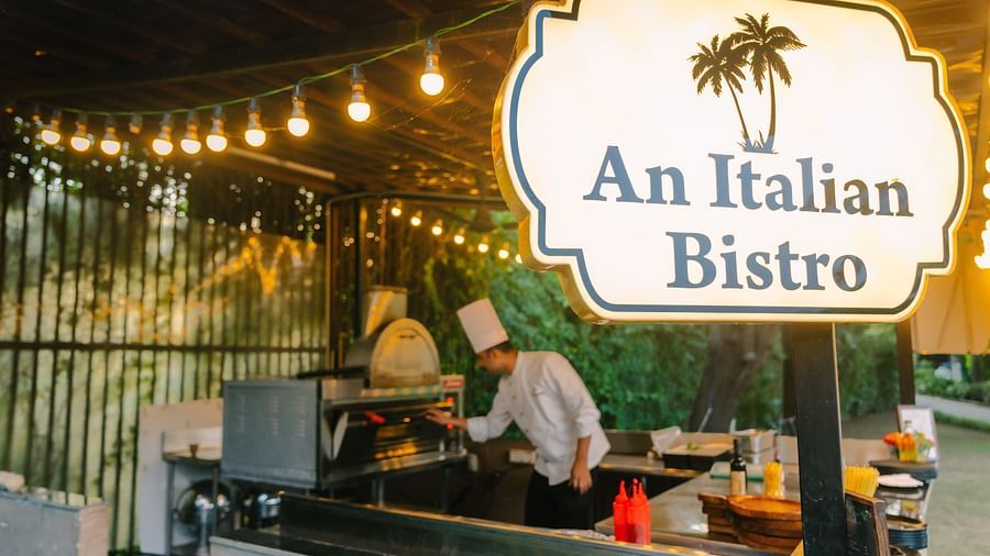 An Italian Bistro Restaurant image with a person working in the open kitchen