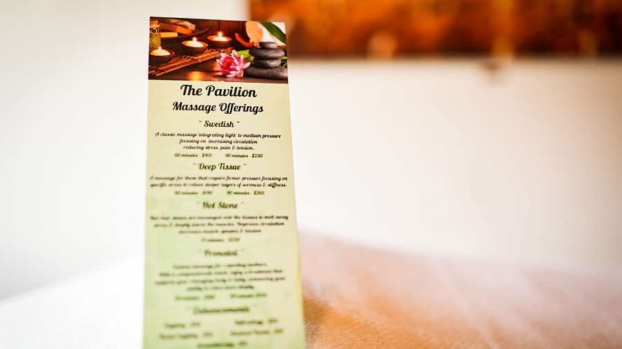 Another angle of the printed menu with warm, blurred lighting in the background - Brewery Gulch Inn & Spa
