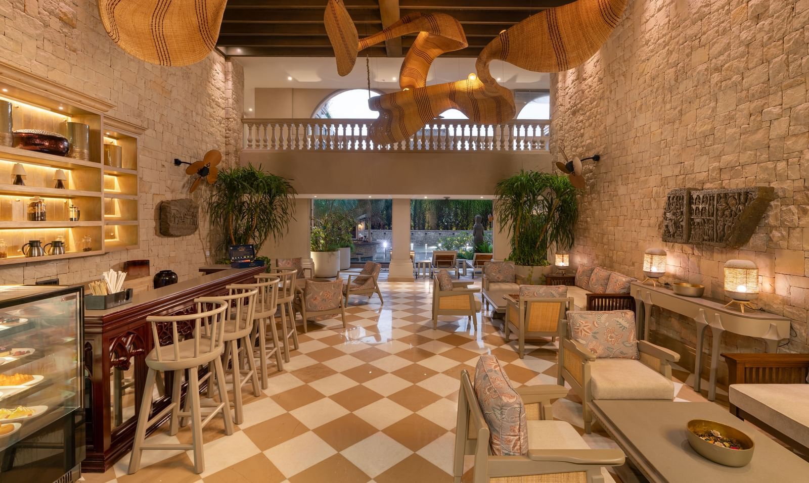 Full view of the Suenos de Cafe featuring a beautiful chandelier hanging from the ceiling.