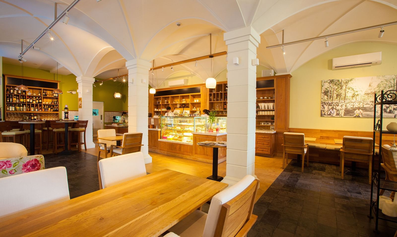 A view of an interior of a restaurant with tables and chairs | The Shop | Central Mansions, Phnom Penh