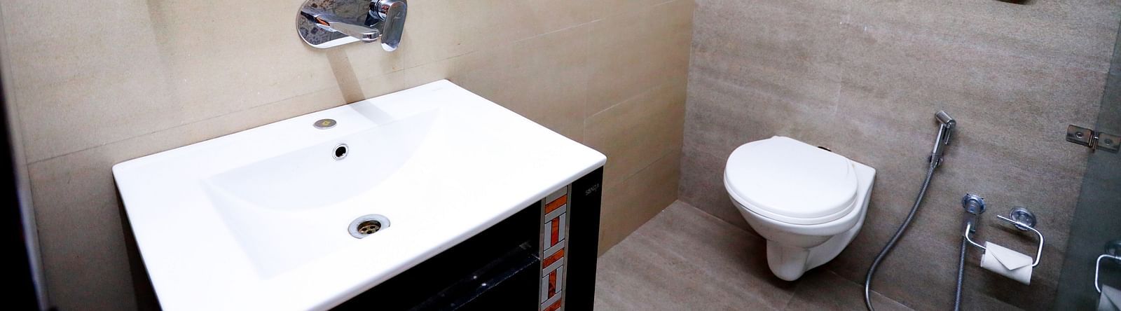 Image of a washroom with a sink and a toilet at Amara Hill Queen, Mussoorie.