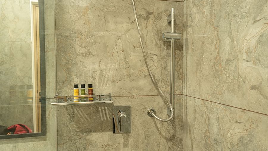 shower in the bathroom of the suite at Triptam Hotel, Vrindavan