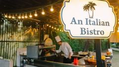 An Italian Bistro Restaurant image with a person working in the open kitchen