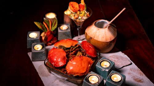 Image of different kinds of sea food  along with cocunut water