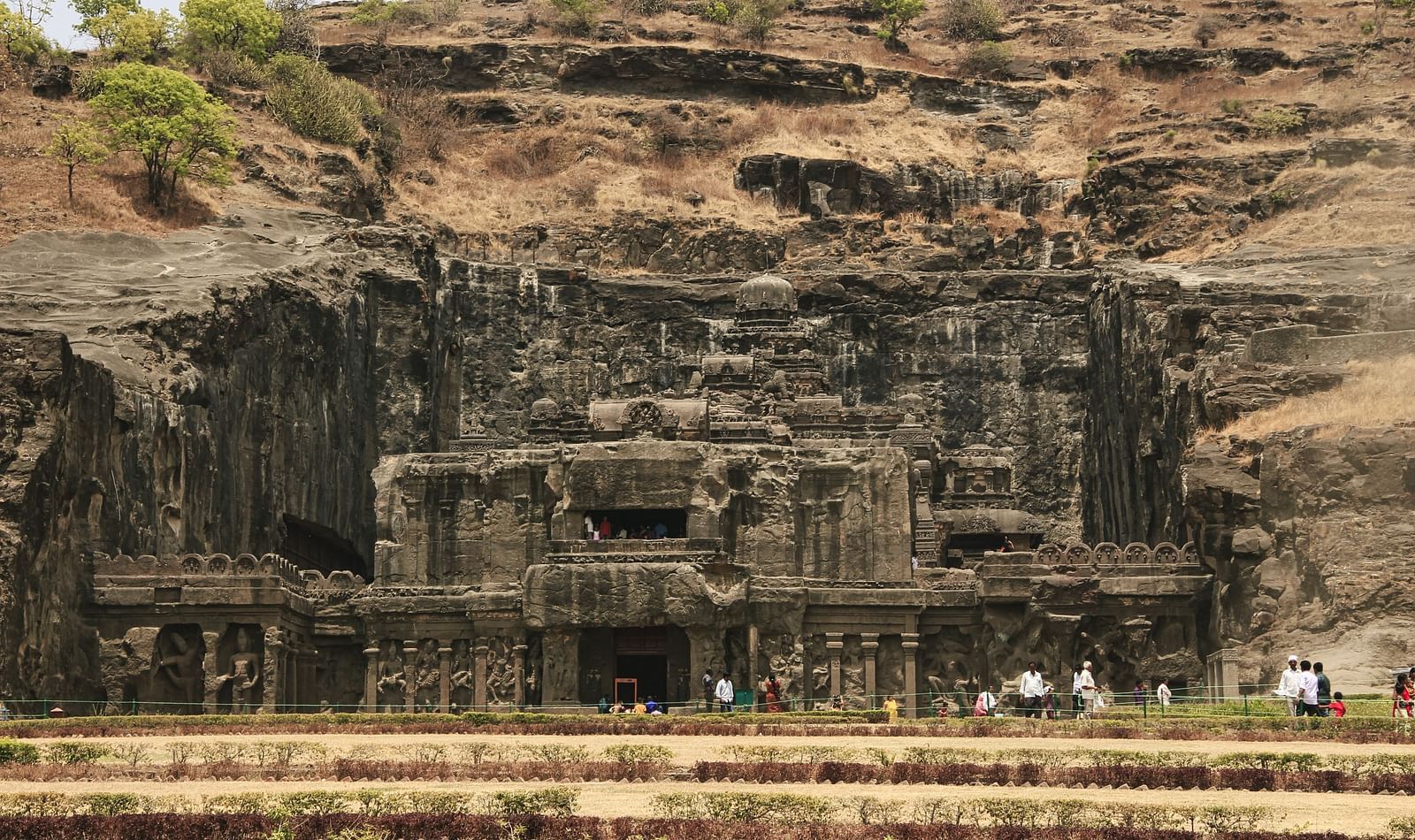 Caves carved into a hill during the day
