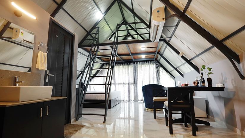 Spacious Family Suite at Holistic Eco-Resort, Kannur with loft bedroom, contemporary furnishings, large windows and sustainable luxury accommodation for families.