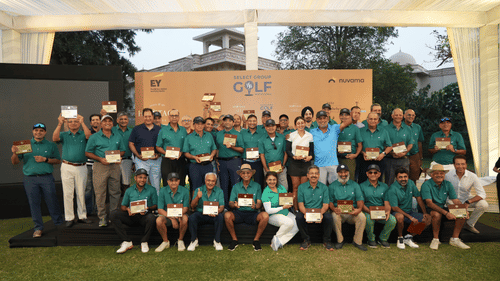 Group photo of participants celebrating their involvement in a prestigious golf tournament.