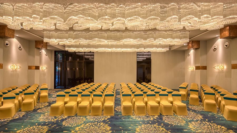Yellow coloured chairs in the Sumo Anaika Banquet Hall at Le Foliage by TGI, Bangalore