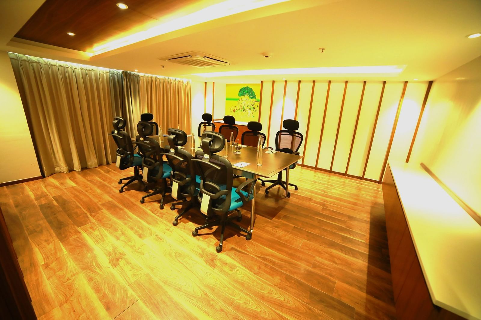 An image of a boardroom with a table and chairs at  Zibe Salem by GRT Hotels