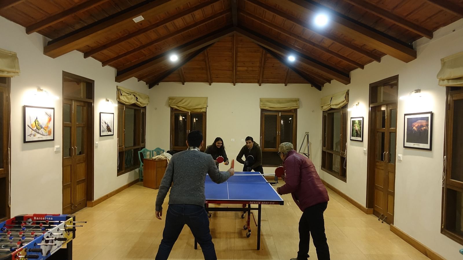 Guests enjoying a game of table tennis in the recreational room - BluSalzz Escapade - Anant Rasa Resort
