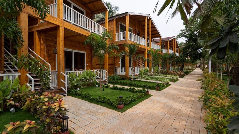 a path surrounded by villas and greenery at Aralea Beach Resort by Stone Wood, Morjim