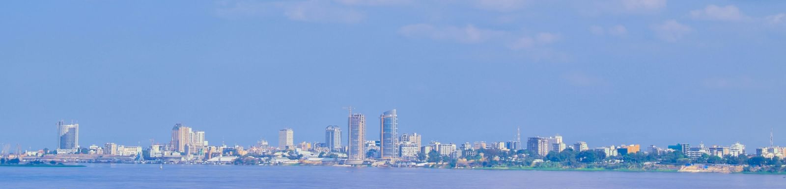 view of the skyline of Kinshasa from across the Congo River