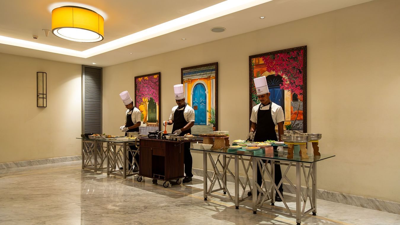 Chefs arranging food to serve to customers at The Residency Towers Puducherry