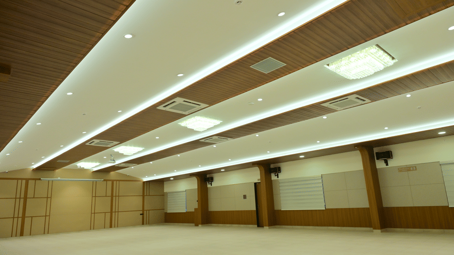 Banquet hall of Bhavanis Vista By Icon featuring pillars and ceiling lighting.