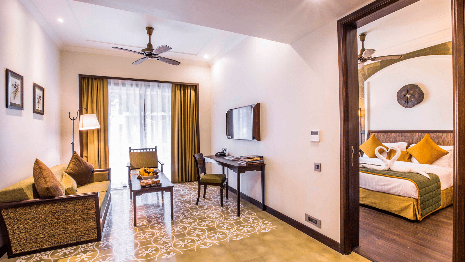 view of the attached living room with the bedroom of the Banyan Family Suite - Rhythm Lonavala