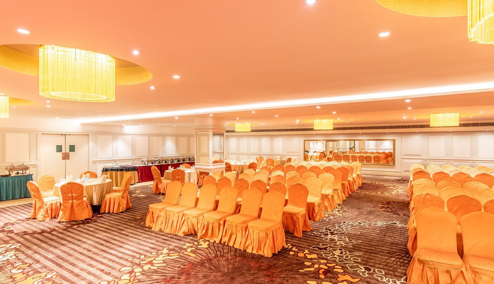 Spacious hall set up in classroom-style seating, ideal for training sessions or workshops