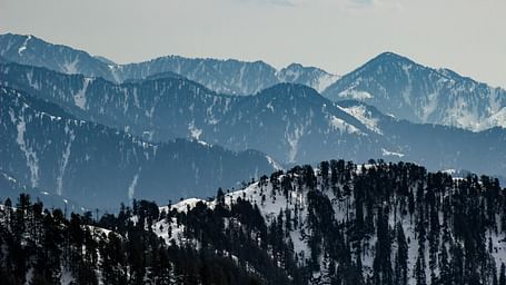 A wide view of snow-covered mountains 