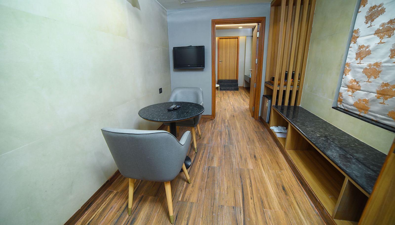 Living room area in the Grand Balcony Room at Grand Palace, Yercaud