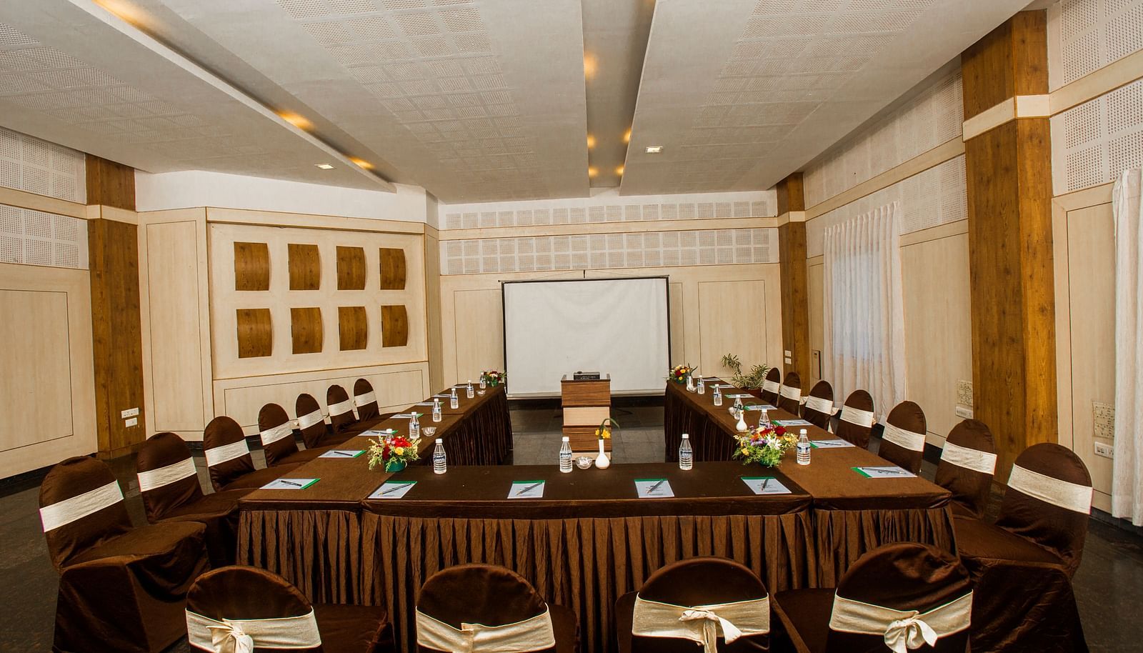 image of the Grand two banquet hall with well organised chairs and a conference table at Grand palace, Yercaud