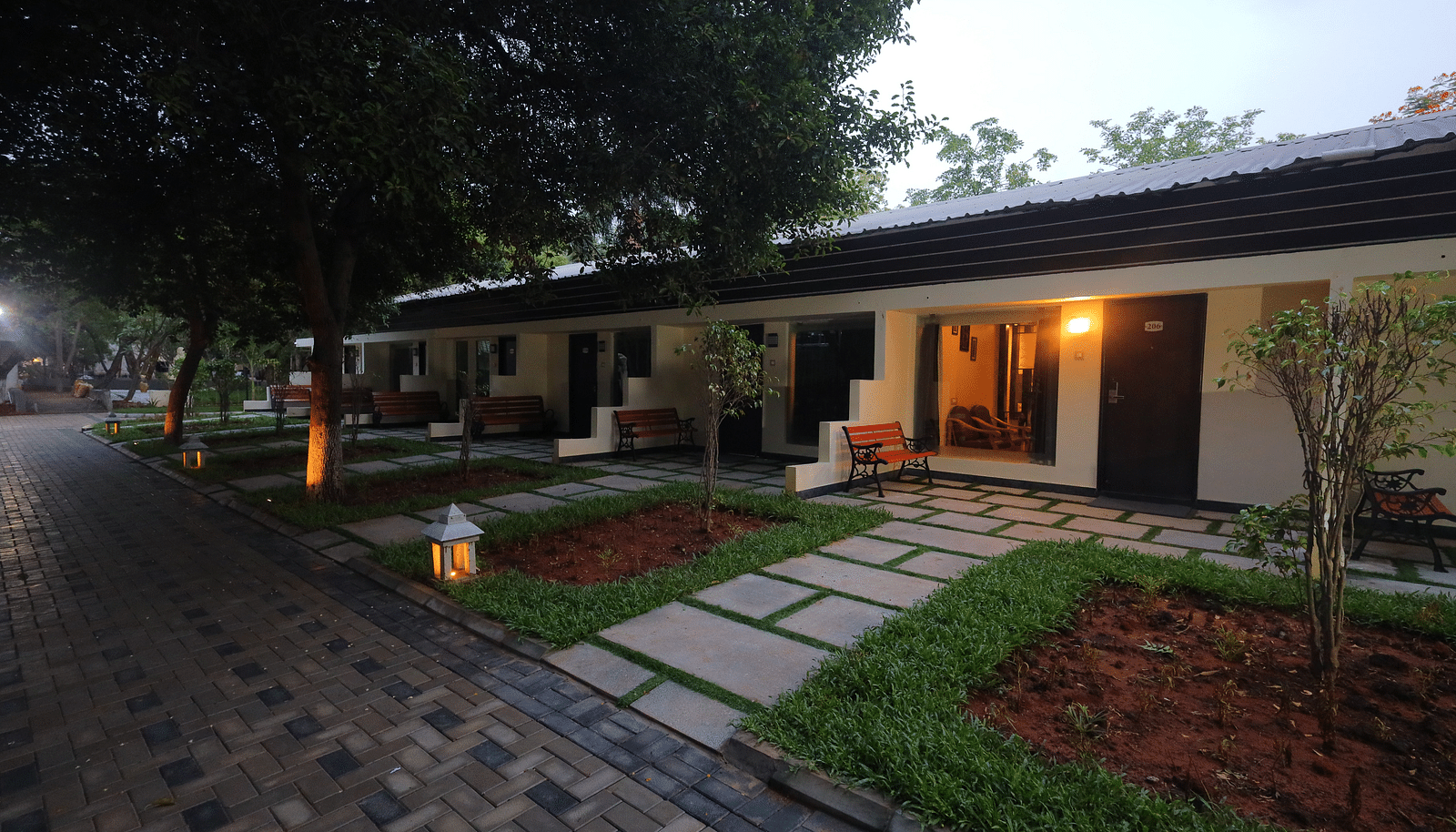 An image of property amidst trees and plants - Sathyam Grand Resort