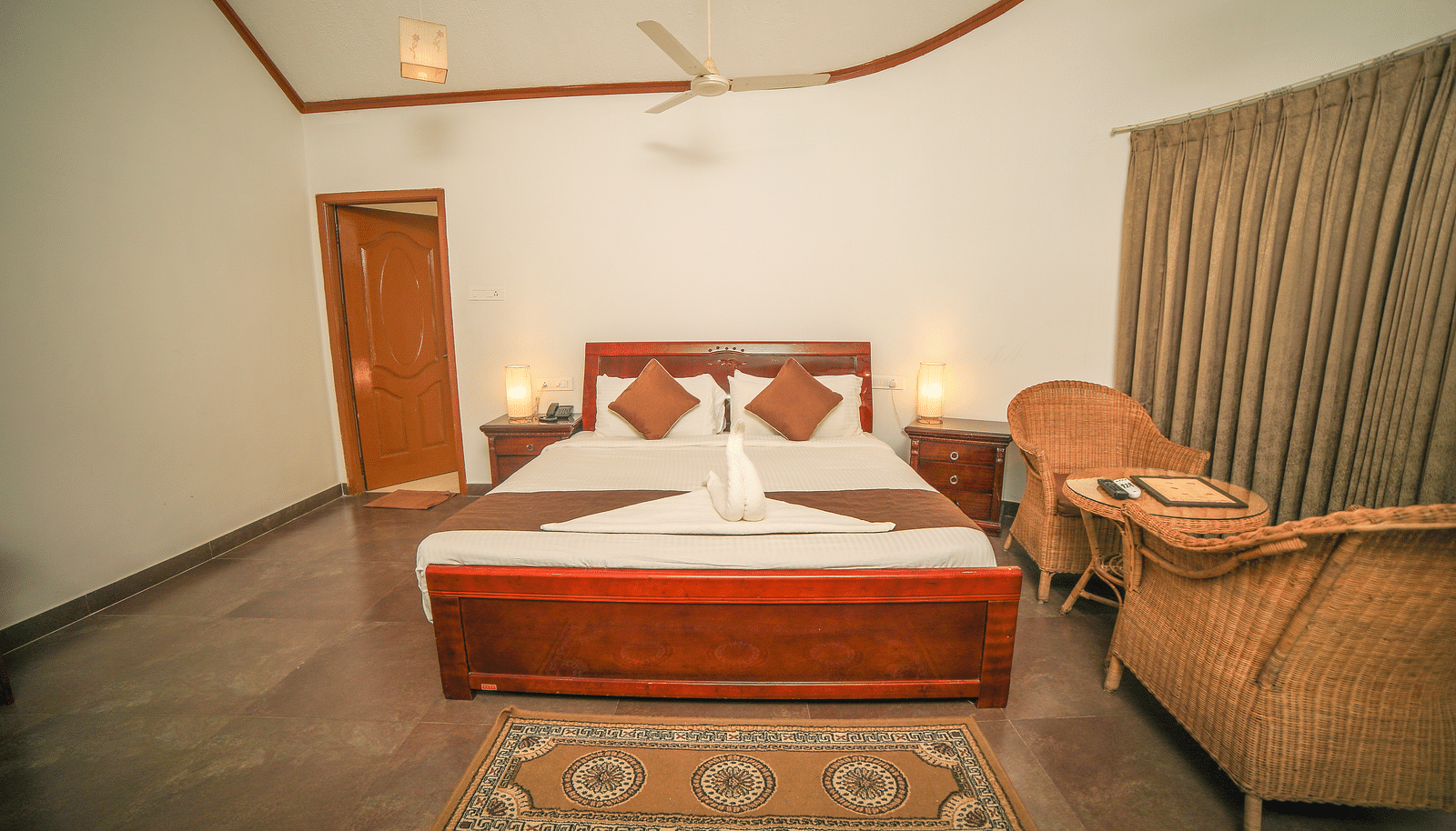 Image of a room with a bed and a seating area on the side at WOW Bison Woods.